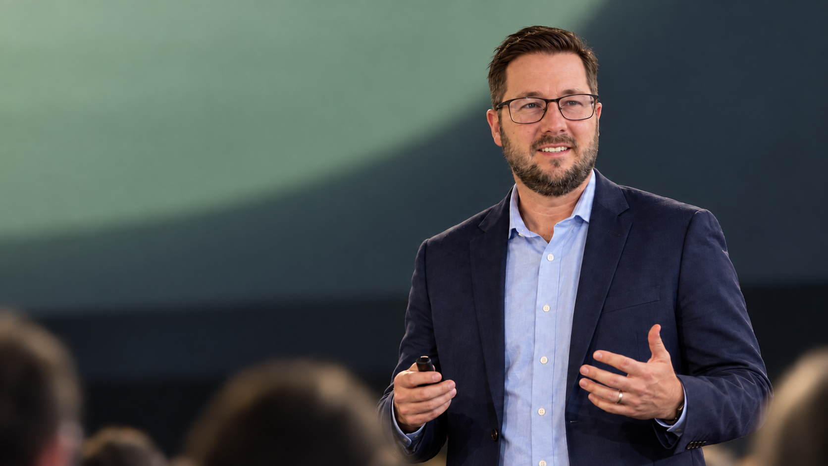 Ben Dewey presenting on a conference stage